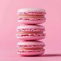 Three pink macarons stacked on top of each other photo