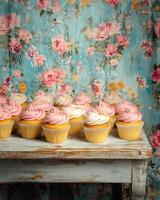 A table with cupcakes on it photo
