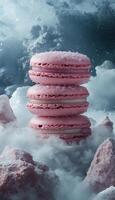 A stack of pink macarons on top of a cloud photo