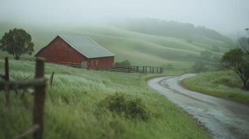 Red Barn on Green Hillside in Mist and Rain photo
