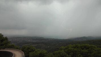 lightning strikes over the sea and mountains in the background video