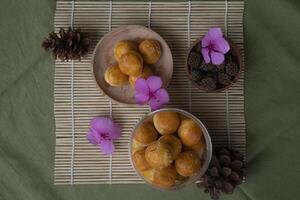 Flatlay view product photography of Nastar or Pineapple tart, a small, bite-size tart filled or topped with pineapple jam. photo