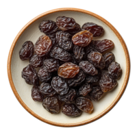 Dried raisins displayed in a round plate with a transparent background highlighting their natural texture, Dried raisins in a plate isolated on transparent background png