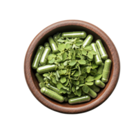Moringa capsules surrounded by fresh moringa leaves in a wooden bowl on a clean transparent background, Moringa capsules in the bowl on transparent background png