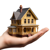 A hand holding a detailed model house showcasing craftsmanship and design features in a creative display, file no background Hand holding a model house png