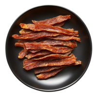 Dried meat strips arranged on a black plate for a savory snack experience, dried meat strips on black plate top view isolated on transparent background png