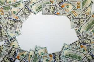 Stacks of hundred dollar bills arranged creatively on a flat surface for financial themes and marketing photo