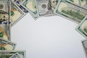 Stacks of hundred dollar bills arranged creatively on a flat surface for financial themes photo