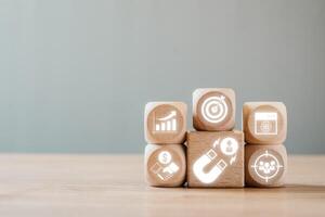 Wooden blocks with digital marketing icons symbolize lead generation and business growth strategies in a modern setting. photo