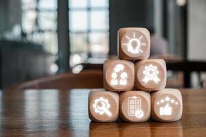 Wooden blocks with icons symbolizing expert advice, showcasing knowledge and professional guidance in a modern setting. photo