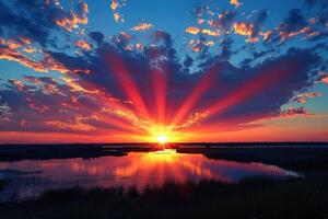 Sunset over a Calm Lake Reflected in the Water photo