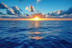 Sunset over a Calm Ocean with Clouds photo