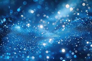 A beautiful blue abstract background with glittering and shiny particles photo