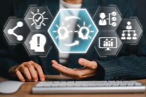Visual representation of knowledge transfer using digital icons and human interaction, symbolizing innovation and learning. photo