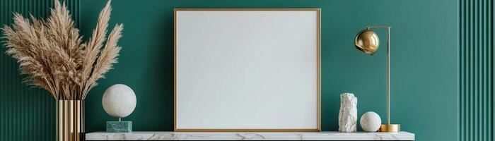 Sleek gold-bordered frame stands on a rich emerald green wall above a marble console. Modern sculptures and a chic lamp enhance the luxurious atmosphere, creating a refined display photo