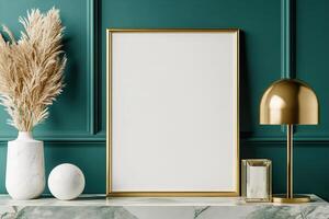 A sleek gold bordered frame stands empty against a deep emerald green wall. Below, a marble console table showcases a gold lamp and modern sculptures, creating an upscale atmosphere photo