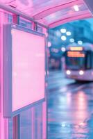A blank advertisement board stands at a modern bus stop with a glass shelter. Pedestrians move in the background as a city bus approaches, creating a lively urban atmosphere photo