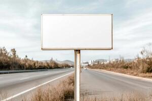 A large blank signboard stands beside a wide highway. The area is vibrant with open landscapes, moving vehicles, and a partly cloudy sky, ideal for advertising or directional purposes photo