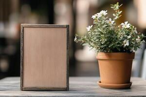 A rustic wooden signboard rests against a flower pot on a cafe terrace table, surrounded by soft golden light, enhancing the inviting atmosphere perfect for patrons photo