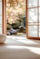 Warm wooden tones and sliding shoji doors create a calming atmosphere in this empty Japanese room. Large windows offer a peaceful view of a softly blurred garden, ideal for meditation photo