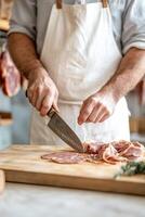 A butcher is meticulously slicing fresh meat with a sharp knife on a wooden block, surrounded by hanging cured meats in a warm, rustic shop interior that exudes craftsmanship photo