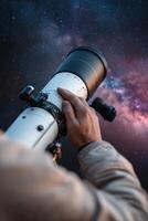 Under a dark starry sky, a skilled astronomer fine-tunes a large telescope aimed at distant nebulae and constellations. The cosmic environment inspires exploration photo