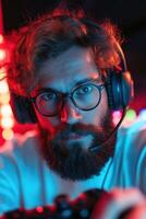 Concentrating deeply, a professional esports gamer engages with a controller while wearing a headset. The setup features glowing technology, adding to the immersive gaming experience photo