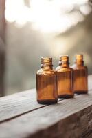 A collection of vintage amber glass bottles rests on a weathered wooden surface, illuminated by gentle sunlight. The soft-focus background enhances the organic and nostalgic atmosphere photo