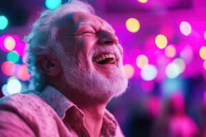 A senior man expresses pure joy while dancing amidst colorful club lights. His laughter brightens the atmosphere, creating a lively scene for entertainment photo