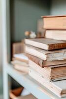 Close-up view of a dusty, cluttered bookshelf showcasing old books, scattered papers, and forgotten trinkets in a messy home office, evoking a sense of nostalgia and chaos photo