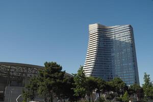 Modern architecture in a vibrant city skyline during daytime photo