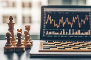 Startups technology competition concept. A chess set alongside a laptop displaying stock market trends. photo