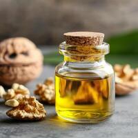Walnut oil in glass bottle concept. A small jar of walnut oil with nuts in the background, highlighting natural ingredients. photo
