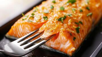 Salmon fillet with crispy skin concept. Freshly cooked salmon fillet garnished with herbs and spices. photo