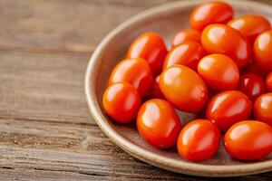 Raw tomato on rustic ceramic plate concept. Fresh cherry tomatoes arranged on a rustic wooden surface. photo