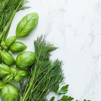 Fresh herbs on marble countertop concept. Fresh herbs including basil and dill displayed on a marble surface, highlighting their vibrant green colors and textures. photo