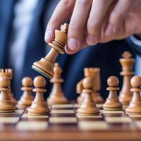 Management problem solving supervision concept. A focused hand moves a chess piece on a wooden chessboard, emphasizing strategy and concentration in the game of chess. photo