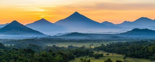 Transformation growth mindset concept. A stunning sunrise over a mountainous landscape, with layers of hills and a misty foreground creating a serene and picturesque view. photo