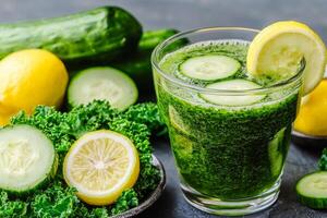 Plant-based diets Food concept. Green smoothie made with kale, cucumber, and lemon slices, surrounded by fresh ingredients for a healthy drink. photo