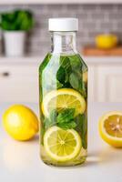 Self-care routines for Wellness concept. Bottle of infused water with lemon slices and mint leaves, set against a bright kitchen background. photo