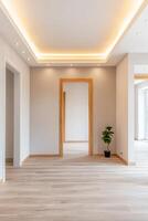 Home improvement with renovation trends concept. Modern interior hallway featuring wood accents, a mirror, and a potted plant, illuminated by soft ceiling lights. photo