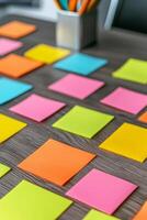 Personalized marketing advertising concept. Colorful sticky notes arranged on a wooden desk for brainstorming sessions. photo