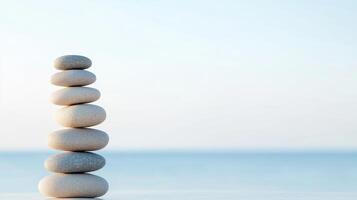 Social justice and community development concept. Stacked stones on a serene beach background evoke tranquility and balance. photo