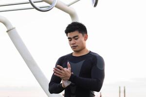 Athletic man with powdered hands photo