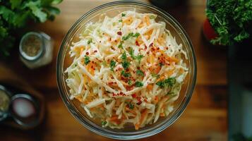 Bowl of coleslaw on a wooden table photo