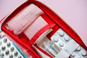 An Essential First Aid Kit A Detailed CloseUp of Various Medical Supplies, Medications, and Essentials You Should Have on Hand for Emergencies and Health Issues photo