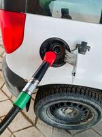Refueling a Vehicles Gas Tank at a Service Station Fuel Pumping in Action, a Common Activity for Drivers on the Go, Ensuring Convenient Access to Energy for Transportation Needs photo