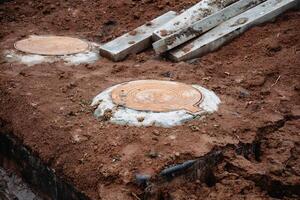 A substantial pile of concrete blocks is currently resting on top of a sizable mound of dirt that consists of various particles and materials, including soil, sand, and mud photo