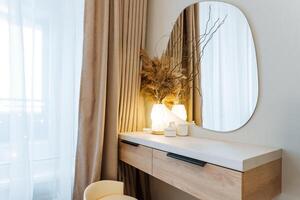 An Elegant Minimalist Vanity Setup aesthetically designed, featuring Natural Elements and Soft Lighting to create a serene atmosphere, perfect for enhancing your daily routine photo