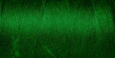 green cotton threads with visible details. background photo